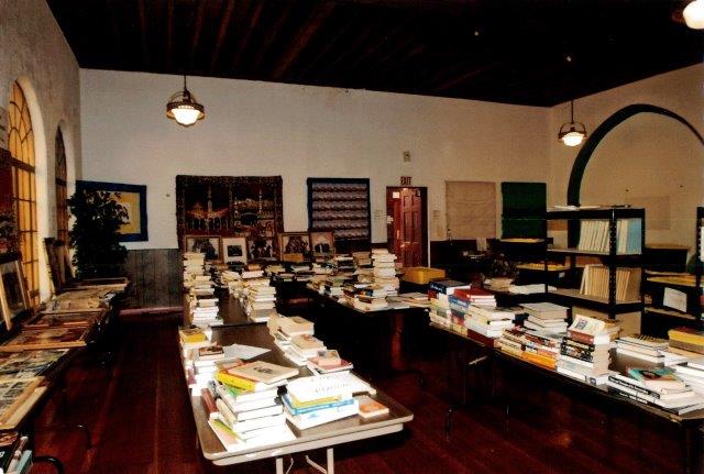 Before: Interior open office space adjacent to the sanctuary with beamed ceiling visible.